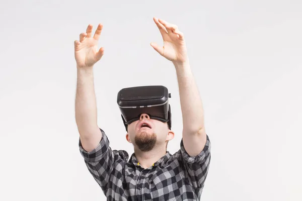 Men raising hands in vr glasses