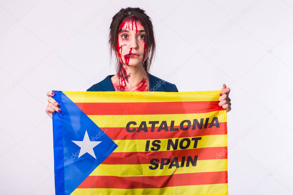 Woman was victim of riots of catalan protesting for spanish government decision about referendum of independence of catalunya