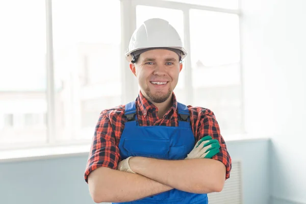 Stock image Closeup portrait of happy caucasian male builder wearing white helmet.