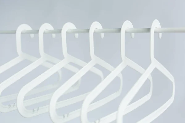 Beauty and fashion concept - Hanger in wardrobe — Stock Photo, Image