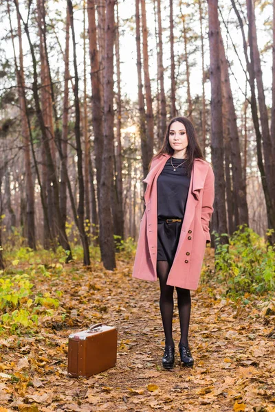 Fall, season and people concept - charming woman standing in park at autumn — Stock Photo, Image