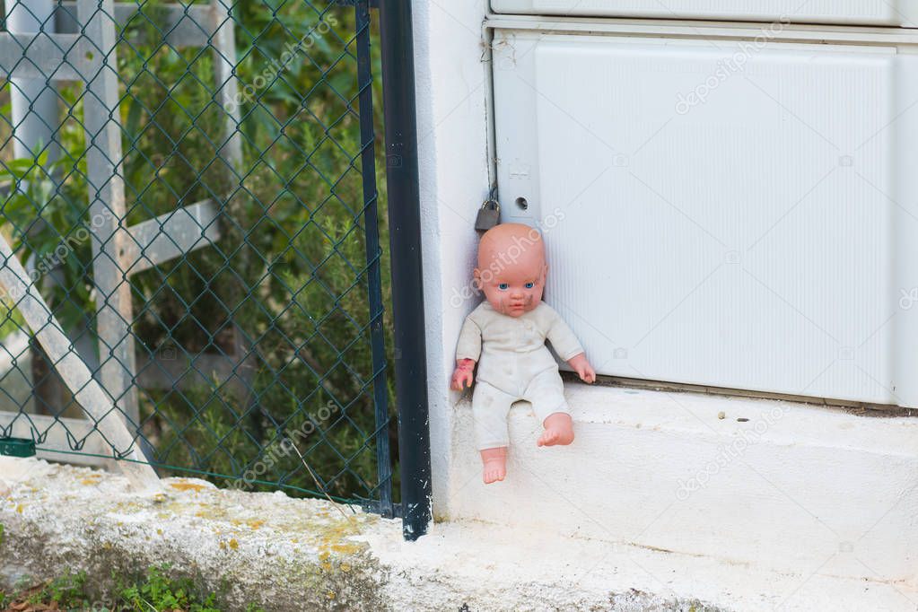 Homeless children, orphans and child abuse - Broken and macabre dolls.