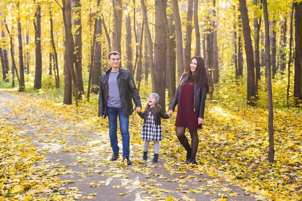 People, family and leisure concept - family having fun standing in autumn park — Stock Photo, Image