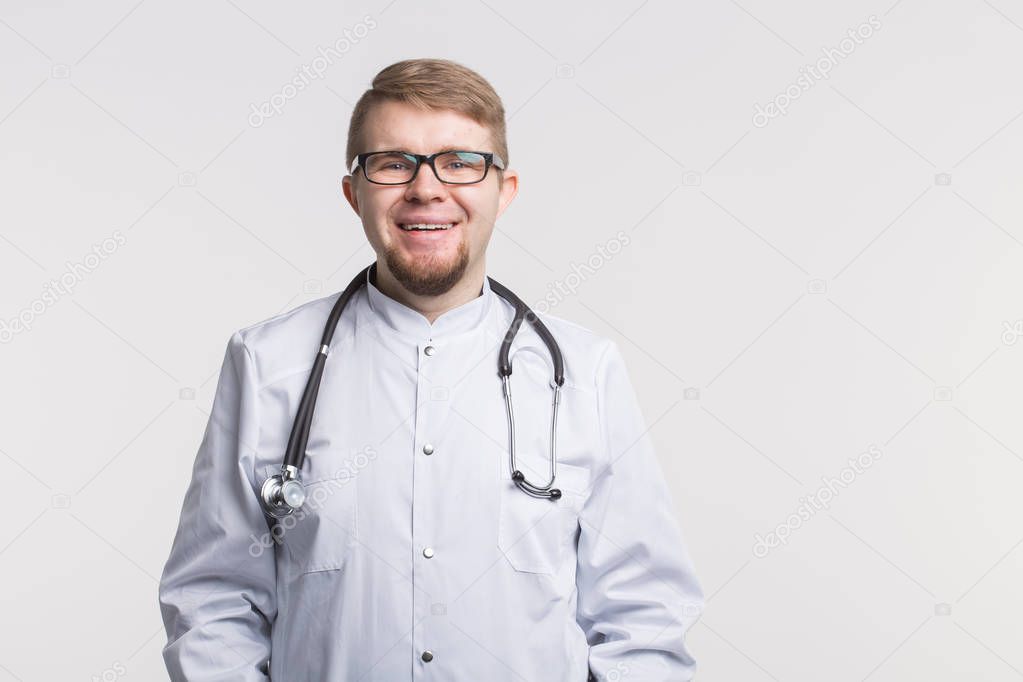 Handsome white doctor man in glasses and white medical gown