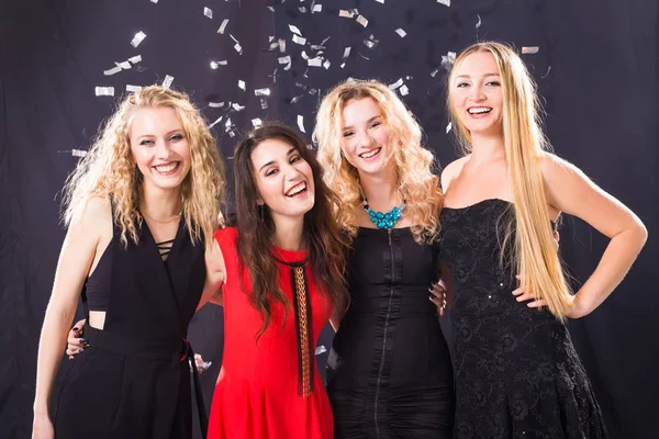 Party, holidays and new year eve concept - Group of cheerful joyful young woman standing and celebrating together over white background. Stock Image