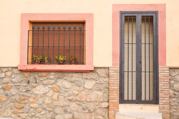 Design, architecture and exterior concept - Small window and door with lattice on the white facade — Stock Photo, Image