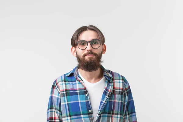 Portrait of a young bearded hipster stylish guy over white background. — Stock Photo, Image