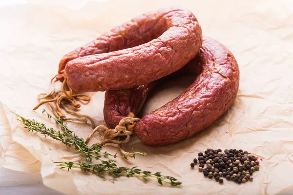 Food, national cuisine and delicious concept - sausages made with horse meat — Stock Photo, Image