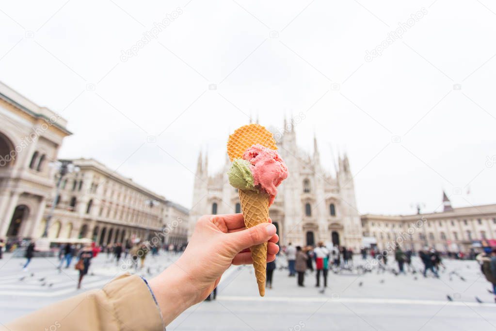 Travel, Italy and holidays concept - Ice cream in front of Milan Cathedral Duomo