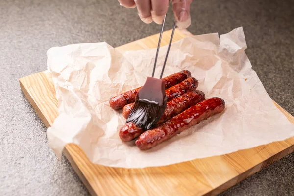 Food concept - Traditional horse meat sausage covered with sauce