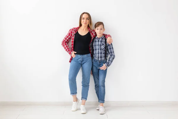 Family, mothers day and teenager concept - Portrait of mother and son on white background — Stock Photo, Image