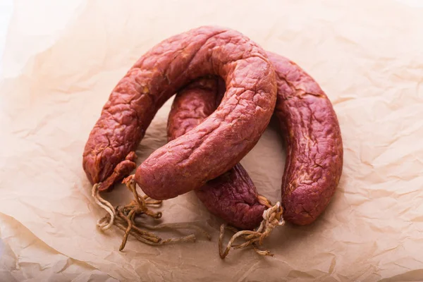 Food, national cuisine and delicious concept - sausages made with horse meat — Stock Photo, Image