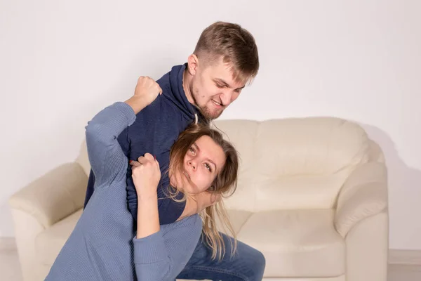 People, abuse and violence concept - aggressive man strangling his wife — Stock Photo, Image