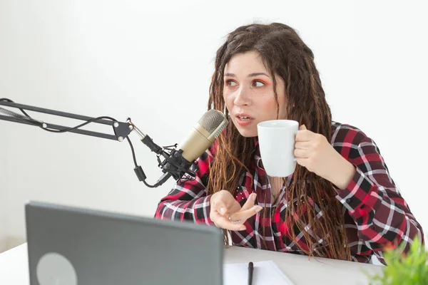 DJ, radio host and blogging concept - young woman working at the studio — Stock Photo, Image