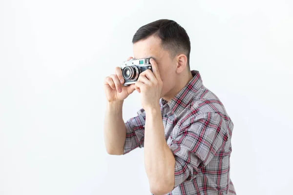 Vintage, photographer and people concept - handsome asian man with retro camera over white background — Stock Photo, Image