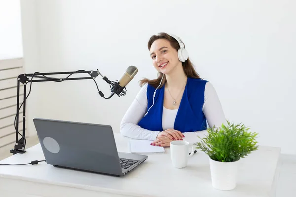 Radio, blogging, podcasting concept - young woman working as a dj on the radio. — Stock Photo, Image