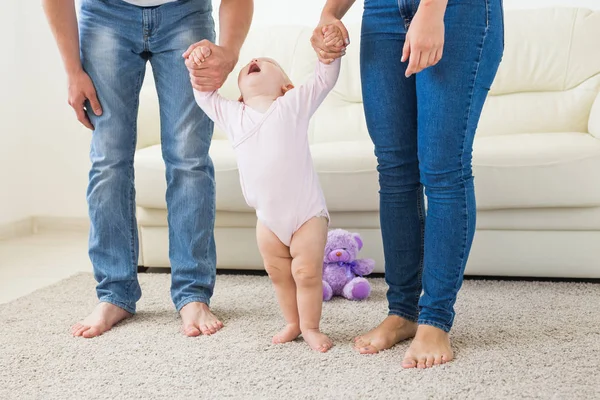 First steps. Little baby girl learning to walk. — Stock Photo, Image