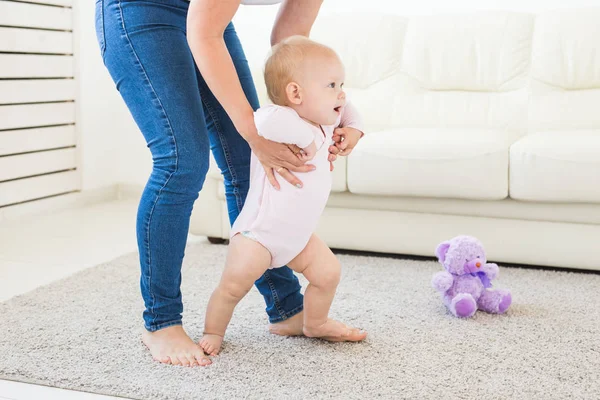 First steps. Little baby girl learning to walk. — Stock Photo, Image