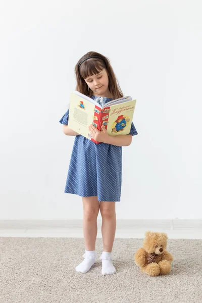 Model, seamstress, designer, people concept - child girl in blue dress over the white background — Stock Photo, Image