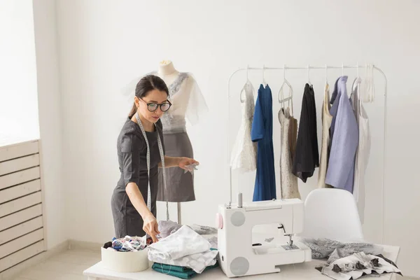 Dressmaker, tailor, fashion and showroom concept - Portrait of talented female dressmaker working with textile for sewing clothes — Stock Photo, Image