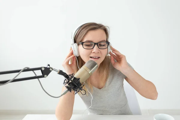 DJ, radio host and blogging concept - close-up of young woman working at the studio — Stock Photo, Image