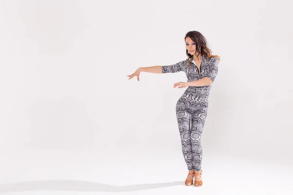 Latina dance, strip dance, contemporary and bachata lady concept - Woman dancing improvisation and moving her long hair on a white background