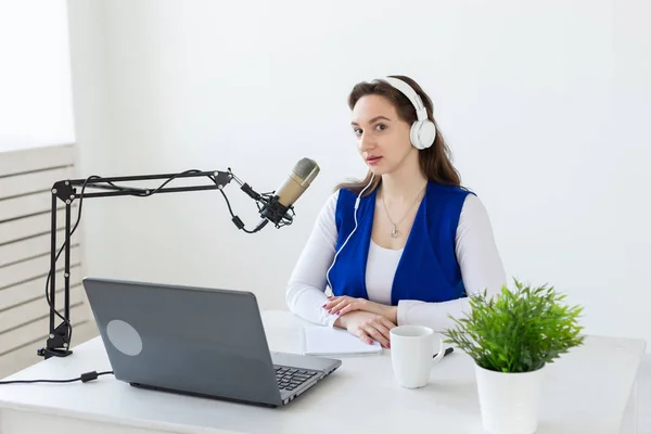 Radio, blogging, podcasting concept - young woman working as a dj on the radio. — Stock Photo, Image