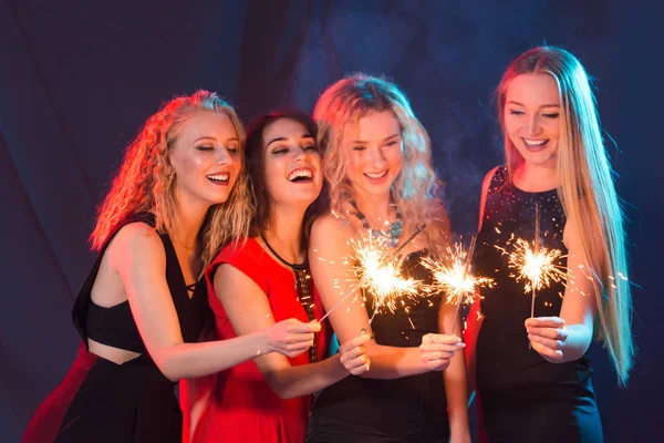 Party, holidays, new year, christmas and nightlife concept - happy young women dancing at night club disco, close-up — Stock Photo, Image