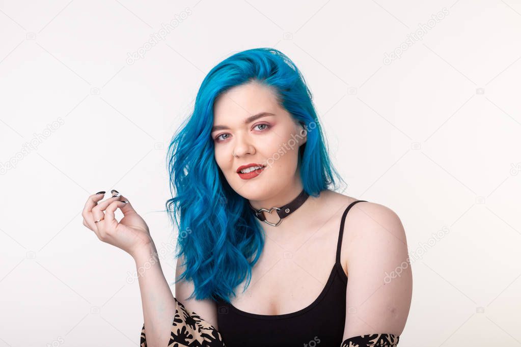 People and fashion concept - Young woman with choker and blue hair posing over white background
