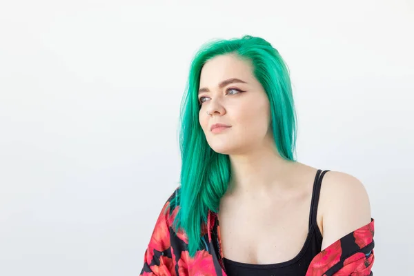 Hairstyle, youth, hair coloring, fashion and style concept - young beautiful woman with green hair over the white background with copy space — Stock Photo, Image