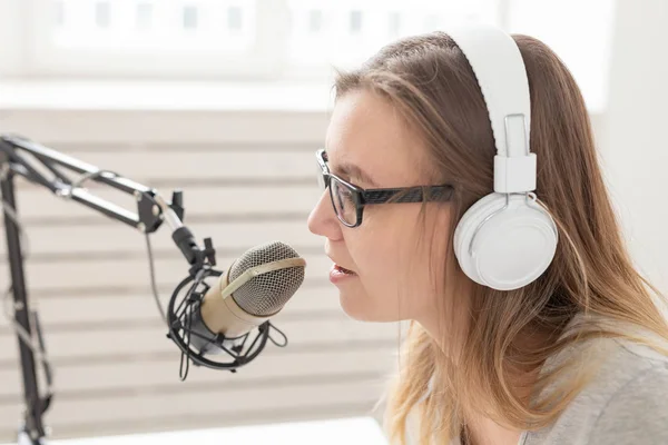 Music, dj, blogging and broadcasting concept - Female radio host with a funny expression, close-up — Stock Photo, Image
