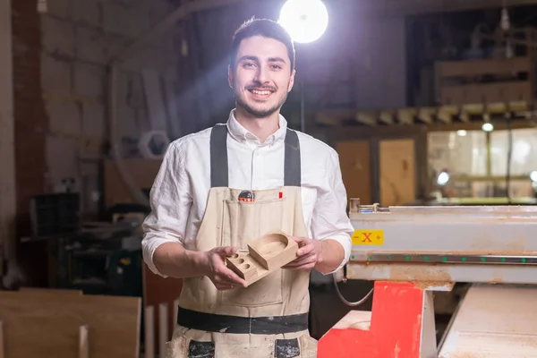 furniture factory, Small-Sized Companies and people concept - Serious concentrated handsome bearded worker of furniture factory