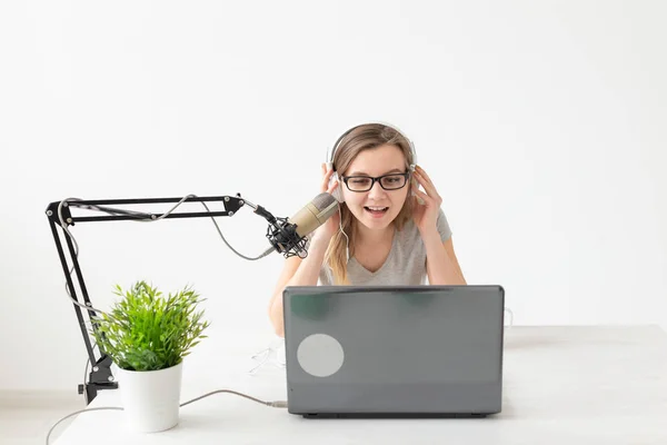 Blogger, streamer and people concept - Funny young woman DJ working on the radio — Stock Photo, Image