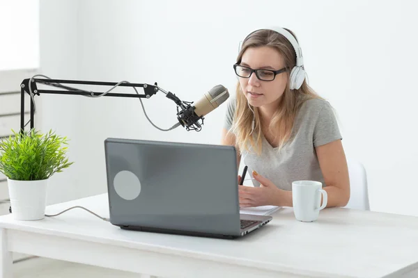 DJ, radio host and blogging concept - young woman working at the studio — Stock Photo, Image