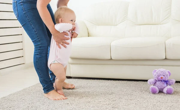 First steps. Little baby girl learning to walk. — Stock Photo, Image
