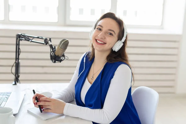 Radio, blogging, broadcast concept - Young woman working on the radio — Stock Photo, Image