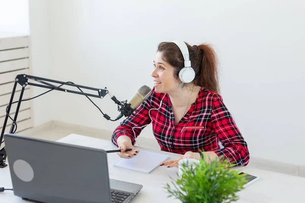 Radio host, blogging, broadcasting concept - young woman working on the radio — Stock Photo, Image