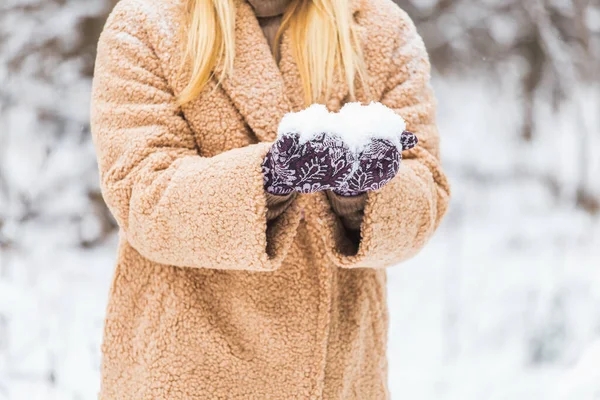 Close up of woman holding snow in hands, winter concept. — Stock Photo, Image