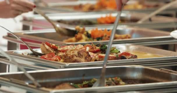 People group catering buffet food indoor in luxury restaurant with meat colorful fruits and vegetables. Close up. Banquet, lunch, bad nutrition, gluttony concept — Stock Video