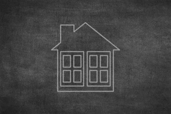 White chalk drawing as house shape on black board — 스톡 사진