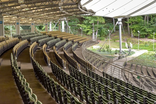 Rows of wooden empty seats — Stock Photo, Image