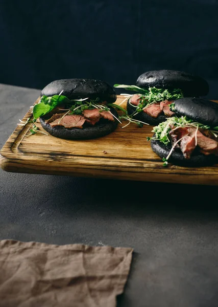 Three Black Burgers Beef Steak Dark Background — Stock Photo, Image