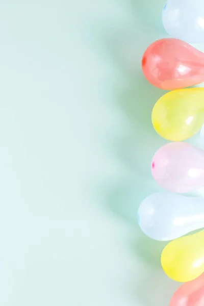 Set different colorful balloons. Pattern decoration party concept on pastel blue background flat lay top view