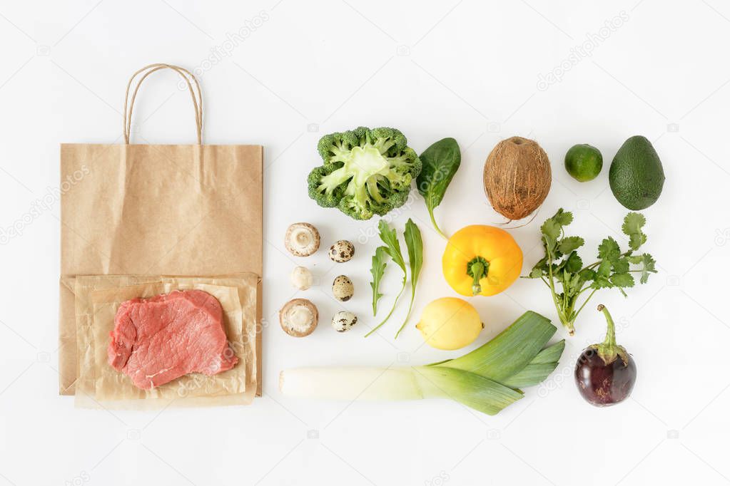 Full paper bag of different health food on white background