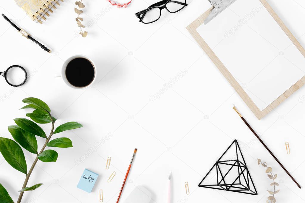 Modern white office desk table with clipboard and accessories