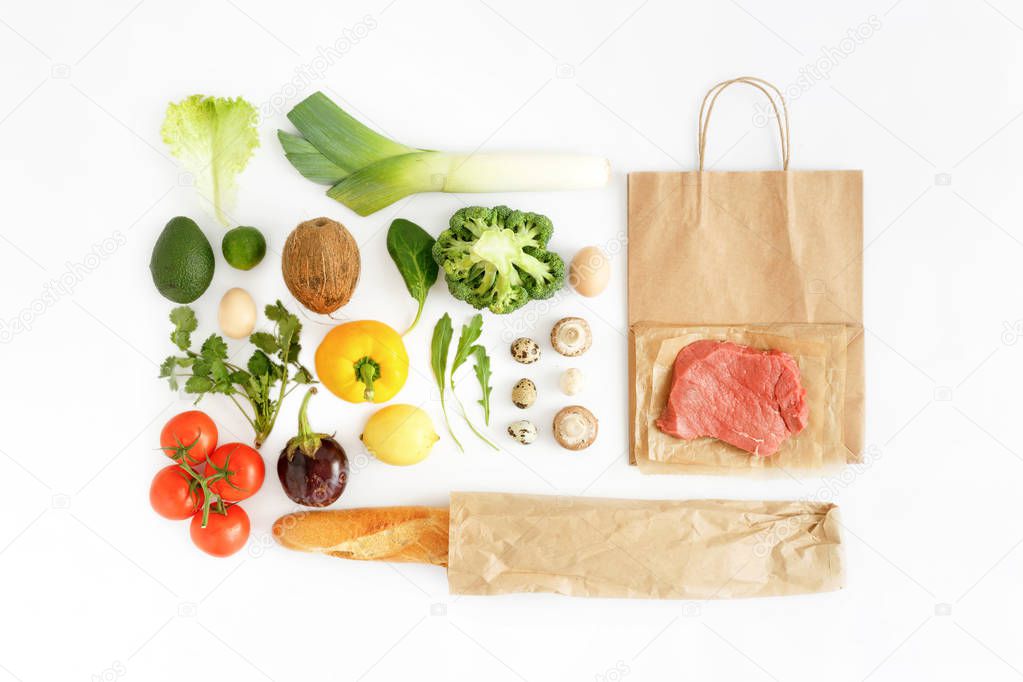 Full paper bag of different health food on white background. Top view. Flat lay. Healthy eating background, top view