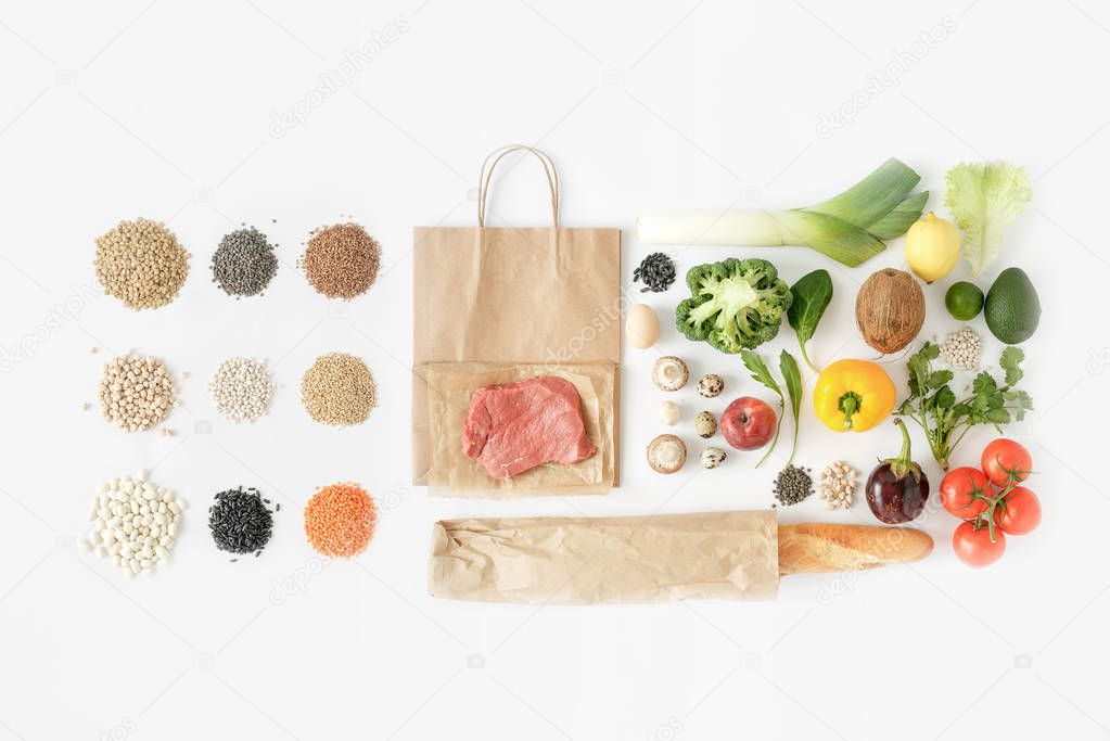 Full paper bag of different health food on white background