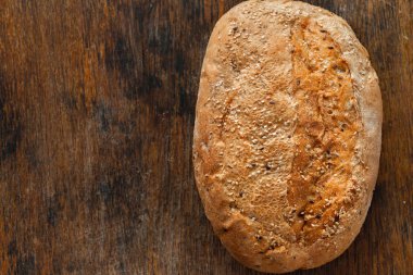 Loaf rye bread with crispy on wooden table 