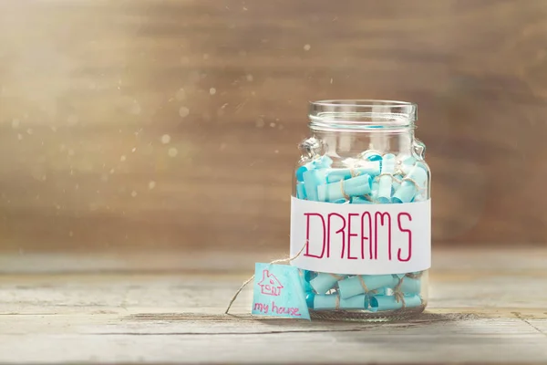 Dream house concept. Dreams jar. Full glass jar of cherished wishes
