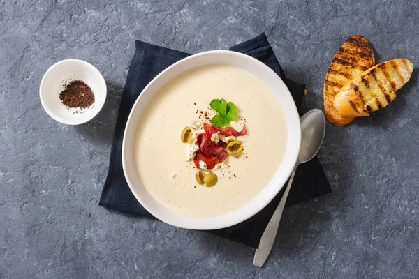 Bowl cheese soup bacon olives top view — Stock Photo, Image